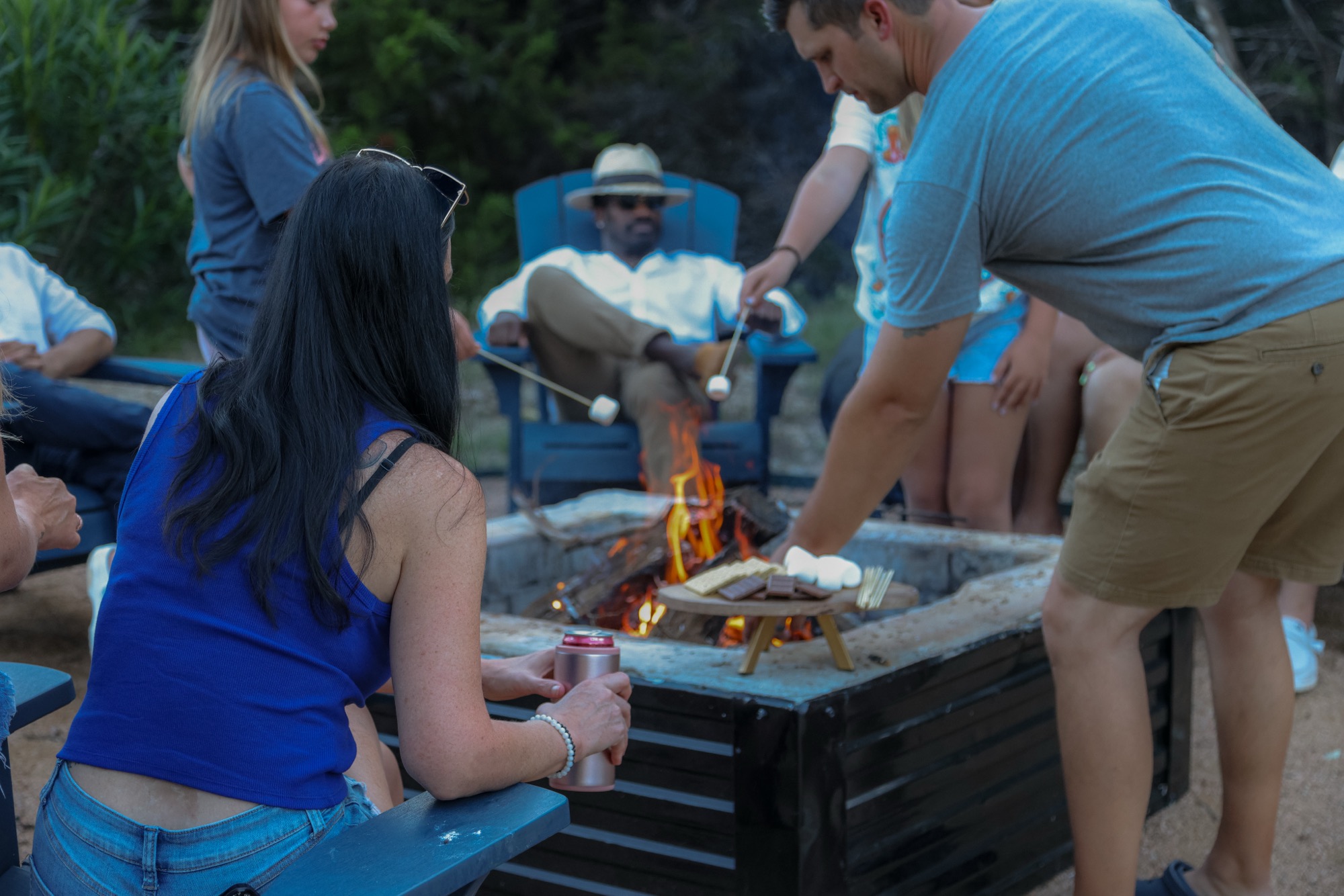 Friends making s'mores at the fire pit