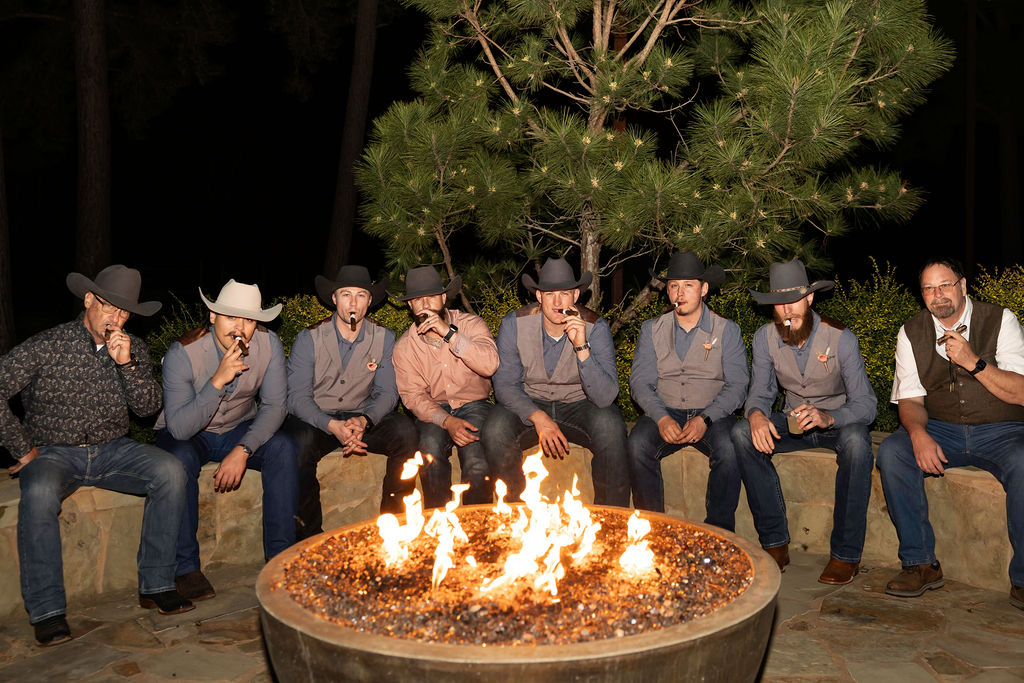 The groomsmen around the fire pit